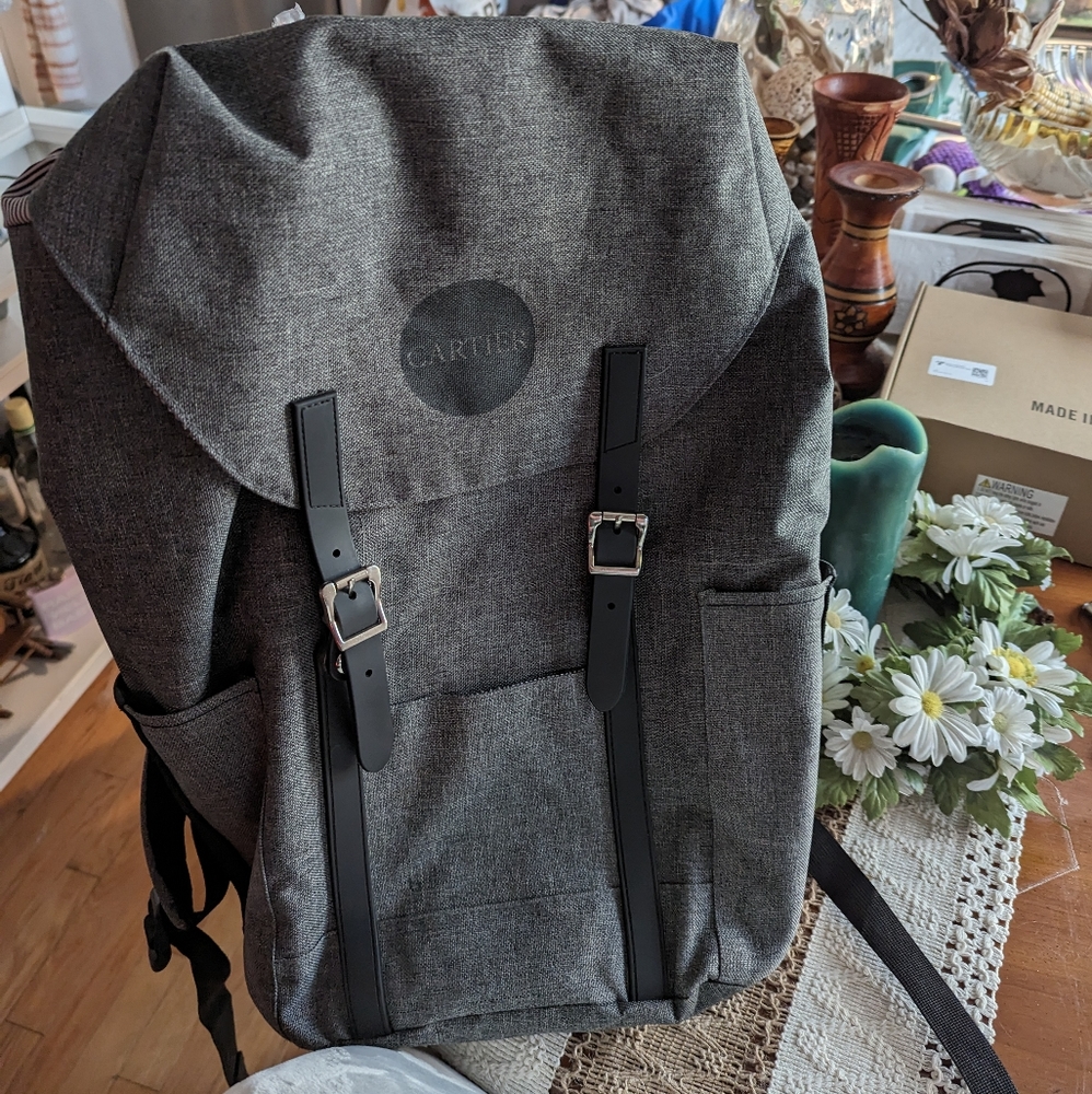 Cartier Branded Ashbury Spectre and Co. Flip top travel Backpack